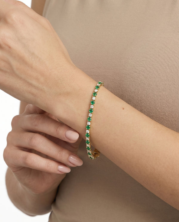 Tennisarmbånd i 14K guld med smaragder og diamanter (0,30 ct), 18,5 cm