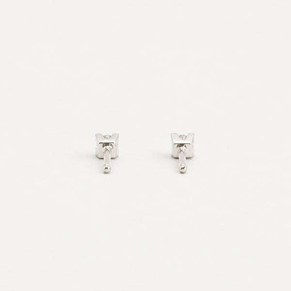 Solitaire øreringe i 14K hvidguld med 2 diamanter (0,11 ct), 1 cm